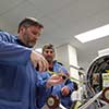 Technicians completing payload assembly